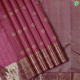 Byzantian Violet Silver Gold Zari With Orange Silk Thread Vairaoosi Checked With Floral Thilagam Butta Motifs And Self Colour With Gold Zari Peacock Kamadhenu Butta Lines Border Traditional Silk Saree