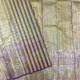 Golden Colour With Silver Gold Zari by Zari Tissue Weave Flower With Leaves Full Body Design And Lavender With Multi Design High Border Exclusive Bridal Silk Saree