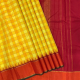 Lemon Yellow With Tiger Orange And Red Out Lined Checks Design And Orangish Red With Red And Green Edge Gold Zari Lines Mid Gap Border Traditional Silk Saree