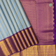 Thunder Grey With Steel Grey And Gold Zari Self Stripes Weaved Design And Purple With Gold Zari Rangoli Floral Design Border Trendy Designer Silk Saree