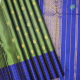 Army Green With Gold Zari Peacock And Flower Pot Design Butta Motifs And Rayal Blue With Gold Zari Vaira Oosi Checked Window Panel Border Traditional Silk Saree