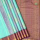 Rexona Green With Dual Tone Purple With Gold Zari Thilagam And Self Designed Stripes Design Purple Blue With Gold Zari Floral Design Bavanji Border Trendy Designer Silk Saree