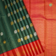 Olive Green With Gold Zari Checked Window Panel Silver And Gold Zari Peacock Butta Motifs With Rose Pink Gold Zari Multi Lines Mid Peacock Butta Motifs Border Traditional Silk Saree  