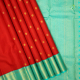 Tomato Red With Gold Zari Rudraksham Butta Motifs And Sea Blue With Gold Zari Two Line Gap Border Traditional Silk Saree