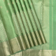 Pista Green With Silver Gold Zari Big Mango Ovel Thilagam And Chakkaram Butta Design And Self Colour Silver Gold Zari Cross Design Border Tissue Silk Saree