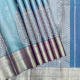 Sea Blue With Silver Gold Zari Big Mango Ovel Thilagam And Chakkaram Butta Design And Self Colour Silver Gold Zari Cross Design Border Tissue Silk Saree